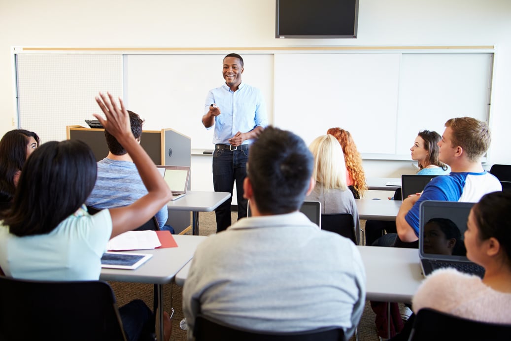 Male Tutor Teaching University Students 